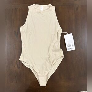 lululemon athletica Women's Nulu High Neck Sleeveless Bodysuit in Light Beige
